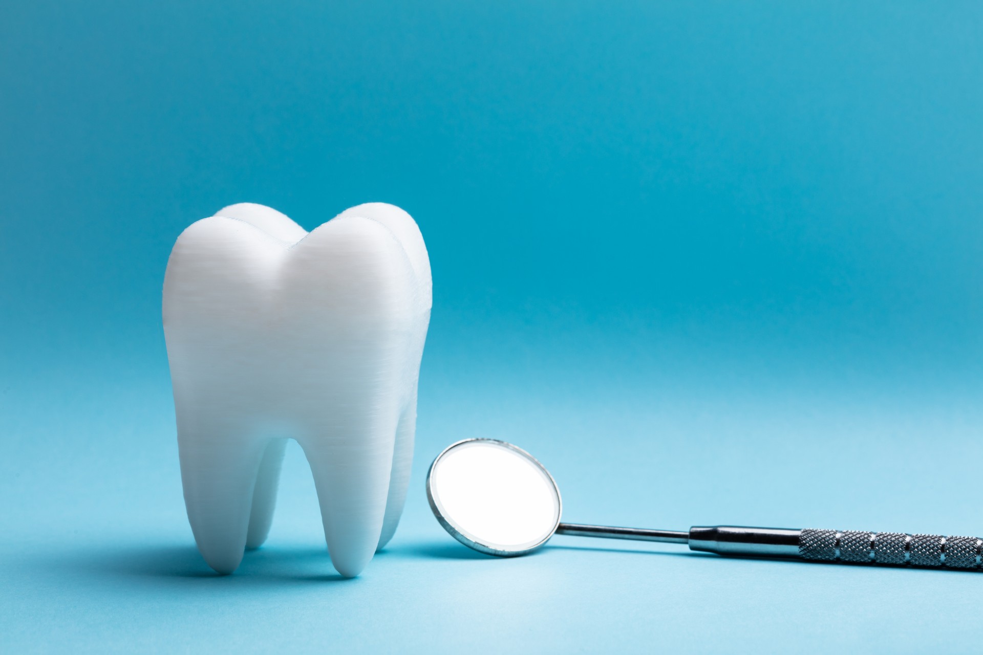 Tooth With Dental Mirror
